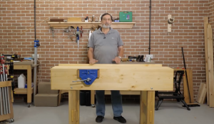 What type of workbench does Paul Sellers advocate for in his videos?